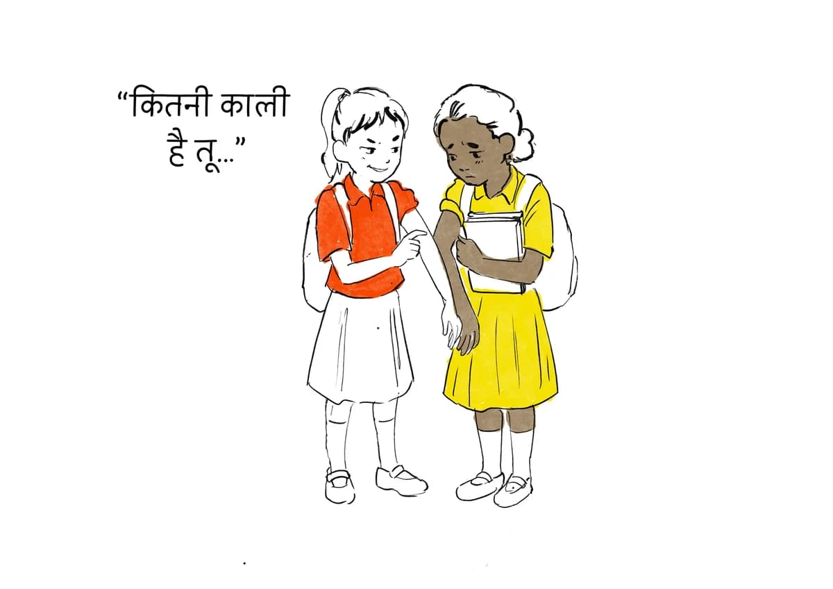 One student points at another's arm and mocks her skin colour while she looks down