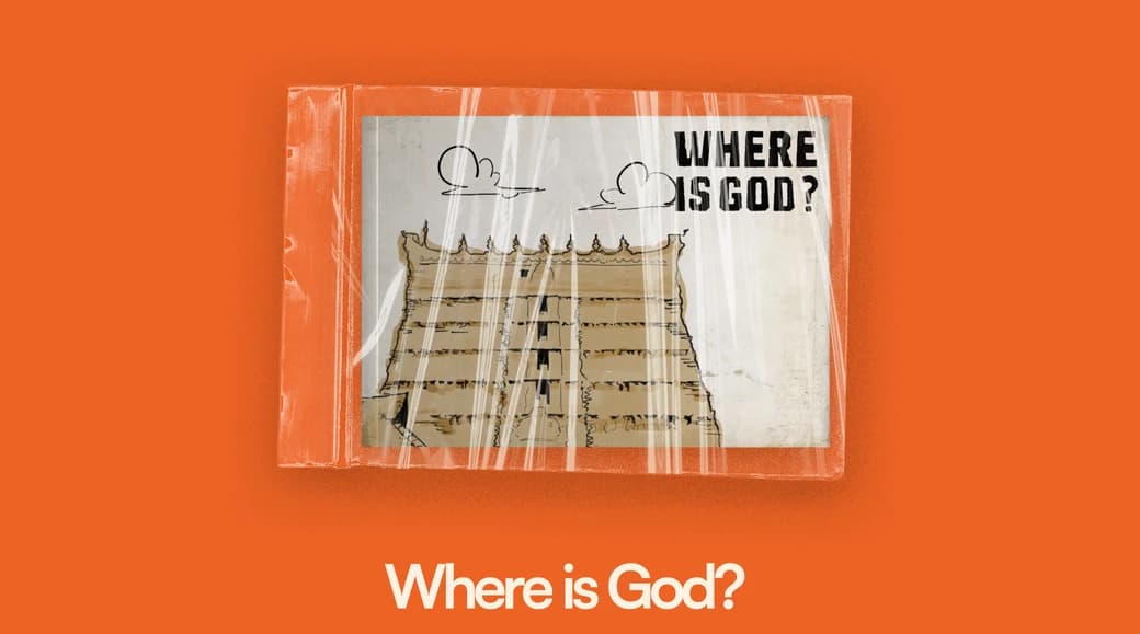 A shrink-wrapped zine on an orange ground, its cover a drawing of a tiered temple roof under the words WHERE IS GOD?, with the title set beneath it.
