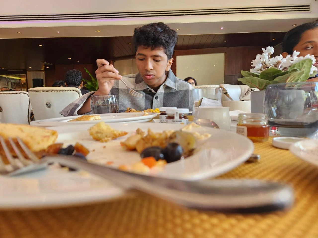 A full table of food mid-meal