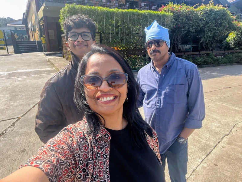 Melvis and parents in a sunny selfie