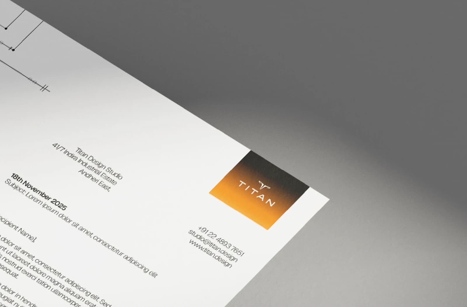The letterhead photographed at an angle, the mark in an amber block at its head